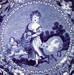 Pearlware London shaped handled cup printed underglaze in medium blue with pastoral/genre scene of girl and sheep. Field dots form background. Continuous repeating floral interior rim. No known pattern name or maker. One of a set of two identical cups from this assemblage. Example of similar complete image on right from a private collector.